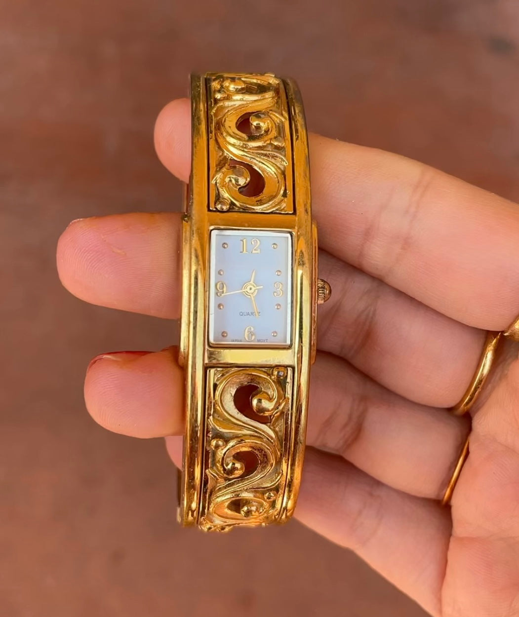 Gold cutout watch